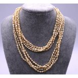 Four nugget pearl strand necklaces