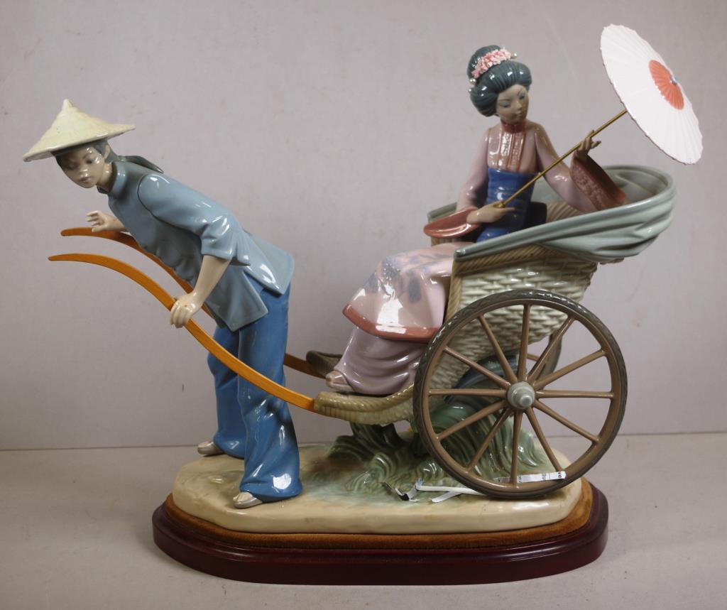 Large Lladro Geisha girl in a rickshaw figurine