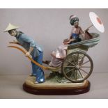 Large Lladro Geisha girl in a rickshaw figurine