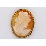 A carved cameo of Perseus set in a gold brooch