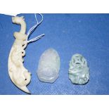 Three various Chinese carved stone pendants