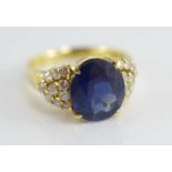A gold, natural sapphire and diamond dress ring