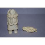 Two antique marine ivory figures