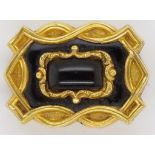 An early 19th c. gold and oynx mourning brooch