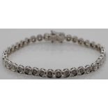 Diamond and 18ct gold bezel set tennis bracelet