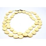 An opera length ivory necklace