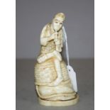 Antique ivory man playing the flute figurine