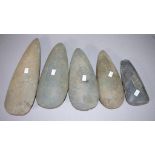 Five various Papua New Guinea stone axe heads