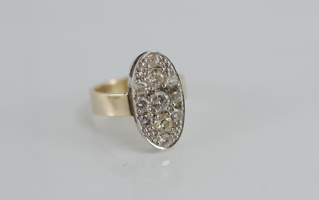 A two tone gold and diamond dress ring