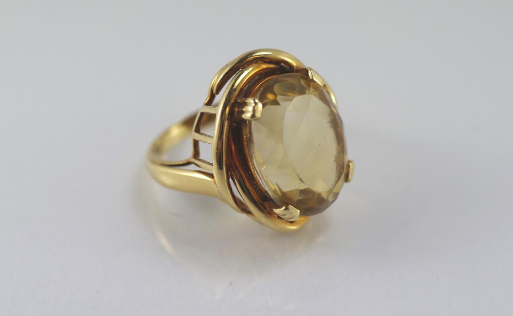 A good yellow gold and citrine ring