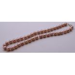 Single strand pink pearl necklace