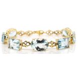 Aquamarine and 18ct gold bracelet.