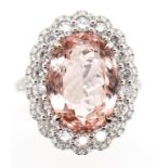 6.17ct Morganite diamond and 18ct gold halo ring.