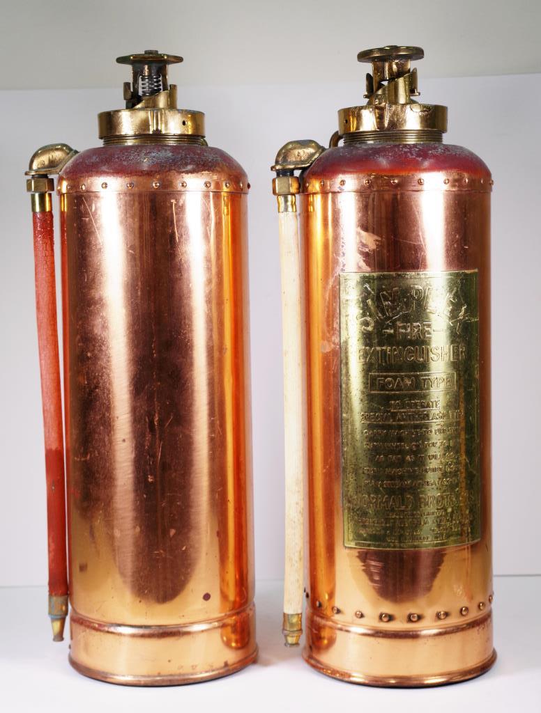 Two vintage simplex fire extinguishers