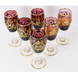 Six Bohemian gilt overlay wine glasses