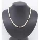 Gold, black bead and white pearl necklace