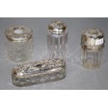 Two various sterling silver topped toilet jars