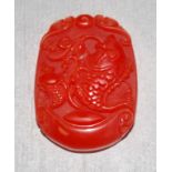 Chinese carved red hard stone fish pendant