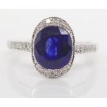 Sapphire diamond and gold halo ring