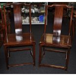 Pair of Chinese yoke back hardwood chairs