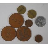 Eight assorted C.S.C trade tokens