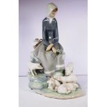 Lladro seated woman with pigs figure