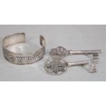 Two Mexican silver key brooches