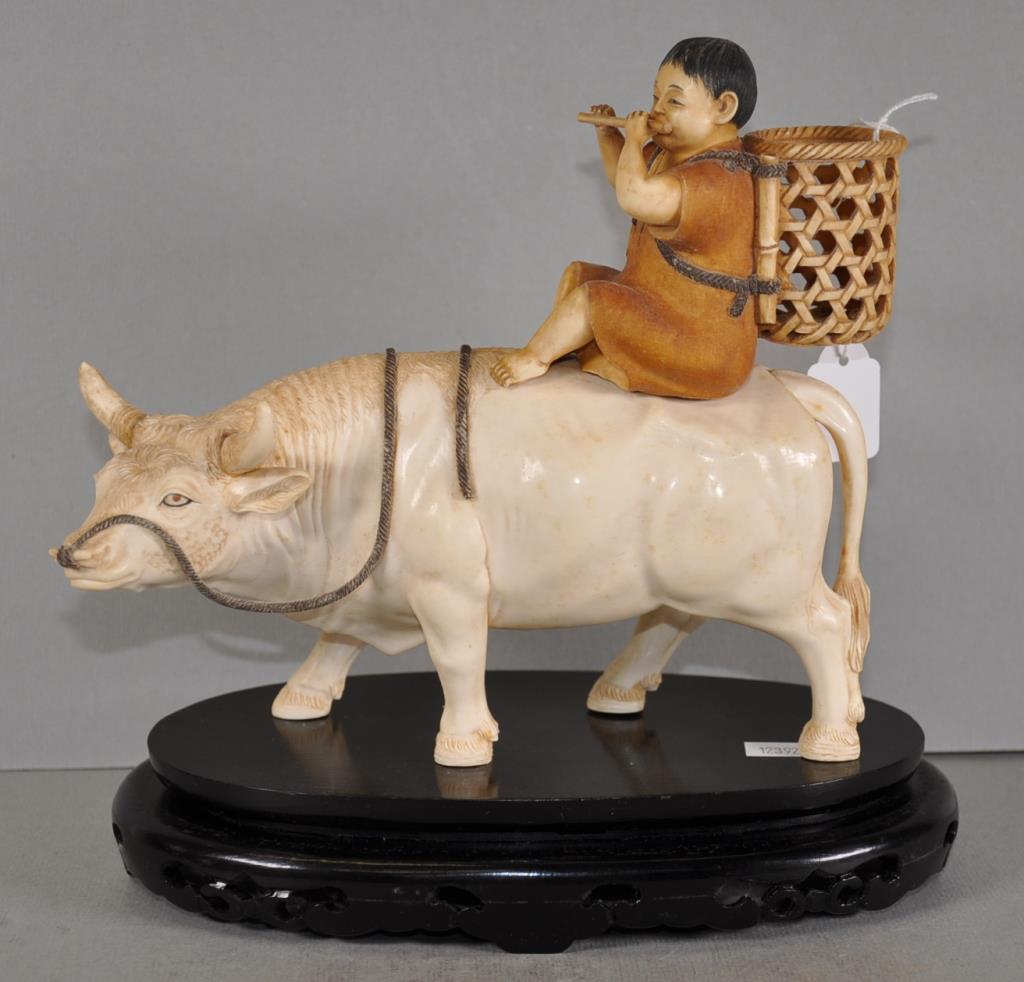 Antique Japanese carved ivory boy on ox figure