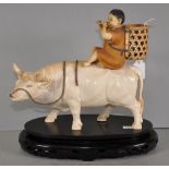 Antique Japanese carved ivory boy on ox figure