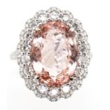 6.17ct Morganite diamond and 18ct gold halo ring.