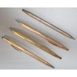 Four gold plated ballpoint pens