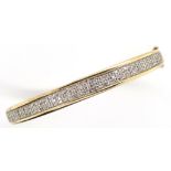 Diamond cluster and 9ct gold bangle