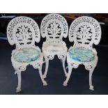 Three vintage cast metal outdoor chairs