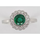 Emerald, diamond and 18ct gold daisy ring