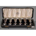 Cased set of six sterling silver tot glasses