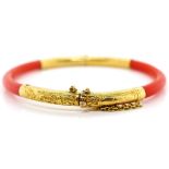 Oriental coral and gold bangle