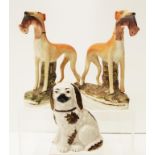 Pair 19th C Staffordshire greyhound figures