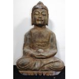 Carved stone seated Buddha figure