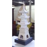 Ornamental pottery pagoda on stand