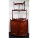 Chinese carved wood shelved cornet cabinet