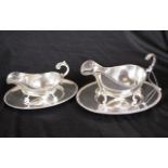Two silver plate sauce jugs & under plates