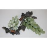 Two oriental carved greenstone bunches of grapes