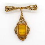 Arts & Crafts gold hanging brooch