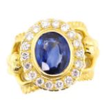 A good Sapphire, diamond and 18ct gold halo ring