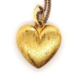 Yellow gold pendant on a silver gilt chain