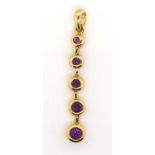 Amethyst and 9ct yellow gold graduated pendant