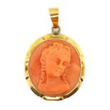 A good carved coral and 14ct gold pendant