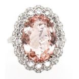 6.17ct Morganite diamond and 18ct gold halo ring.