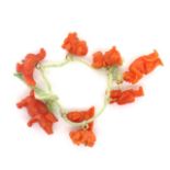 Eight carved coral charms