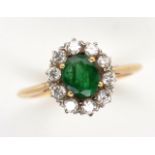 Emerald, diamond and 14ct yellow gold cluster ring